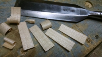 Wedges for the legs. Split a chunk of hard maple and shave them with a wide chisel.