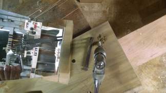Mark out the holes and drill them with the aid of a mirror and bevel gauge.