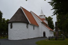 Rear of the church. The red clay roof tiles were ubiquitous on homes around Grimstad, while the wooden shingles were more typical of the stavkirkes that dot the inland of Norway.
